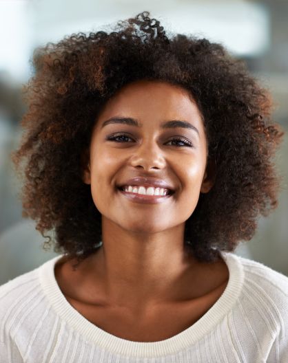 Cheerful youn Afro-American woman with a perfect smile